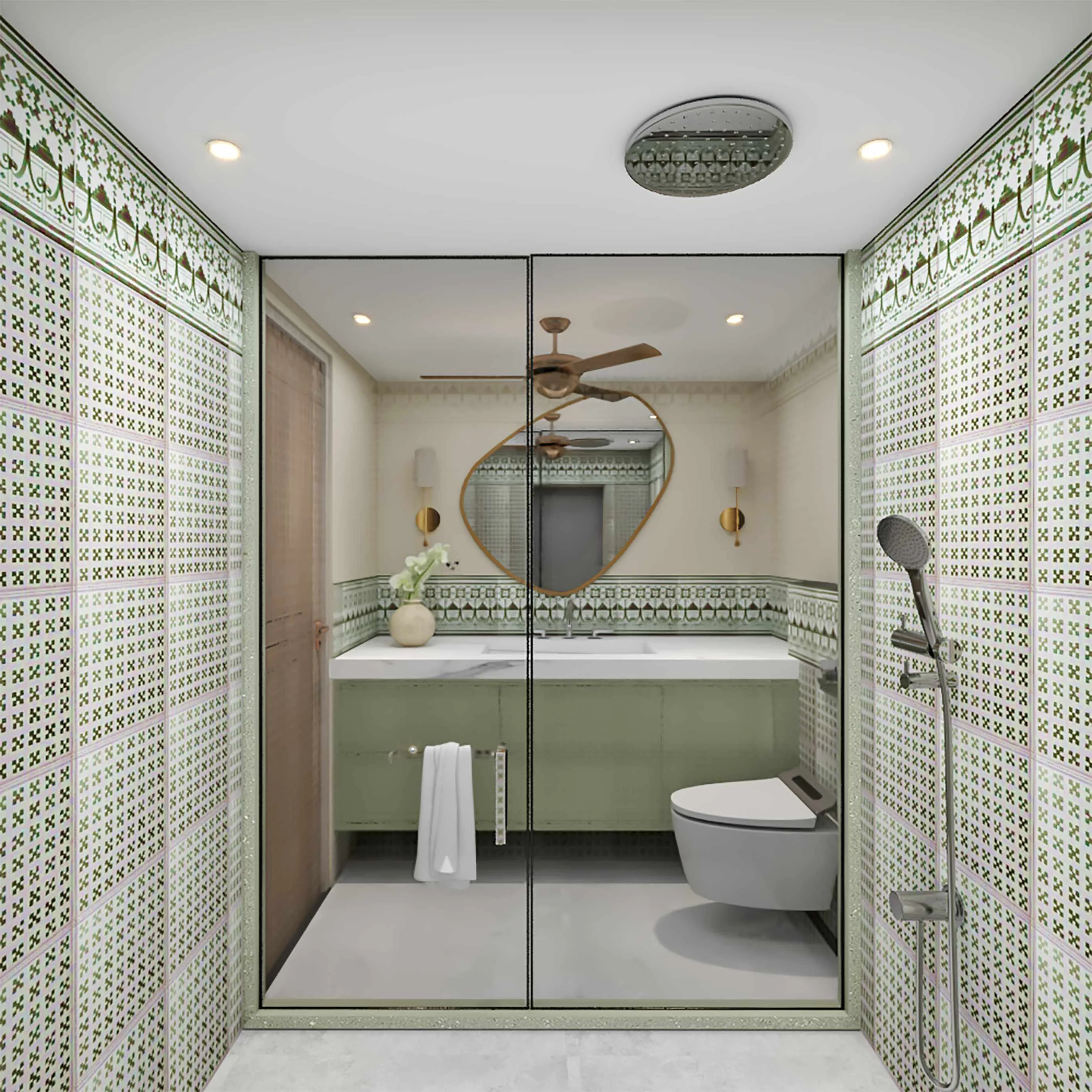 Bathroom in patterned green tile, with an organic-shaped mirror over a sage vanity