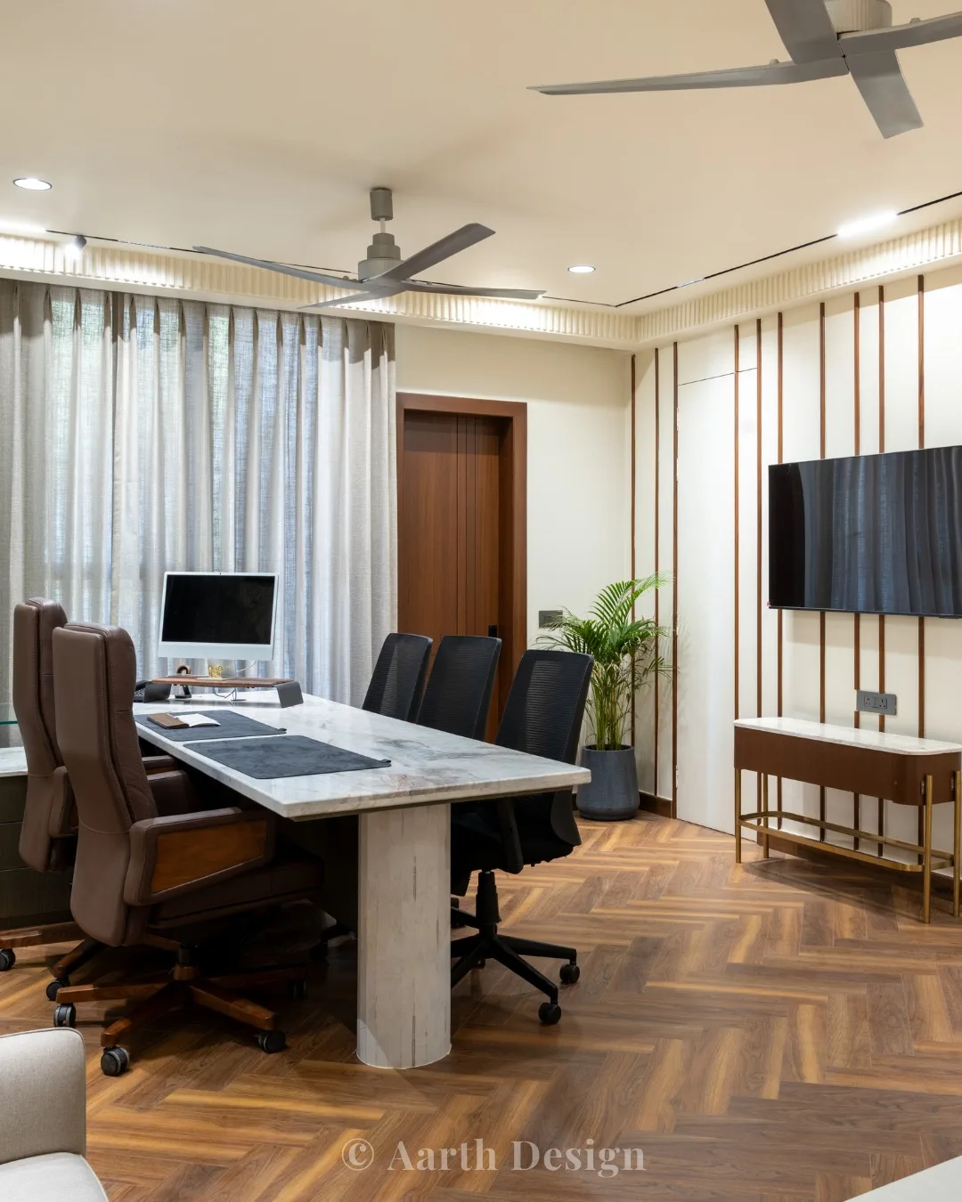 Director's cabin with a marble-topped desk on a herringbone timber floor