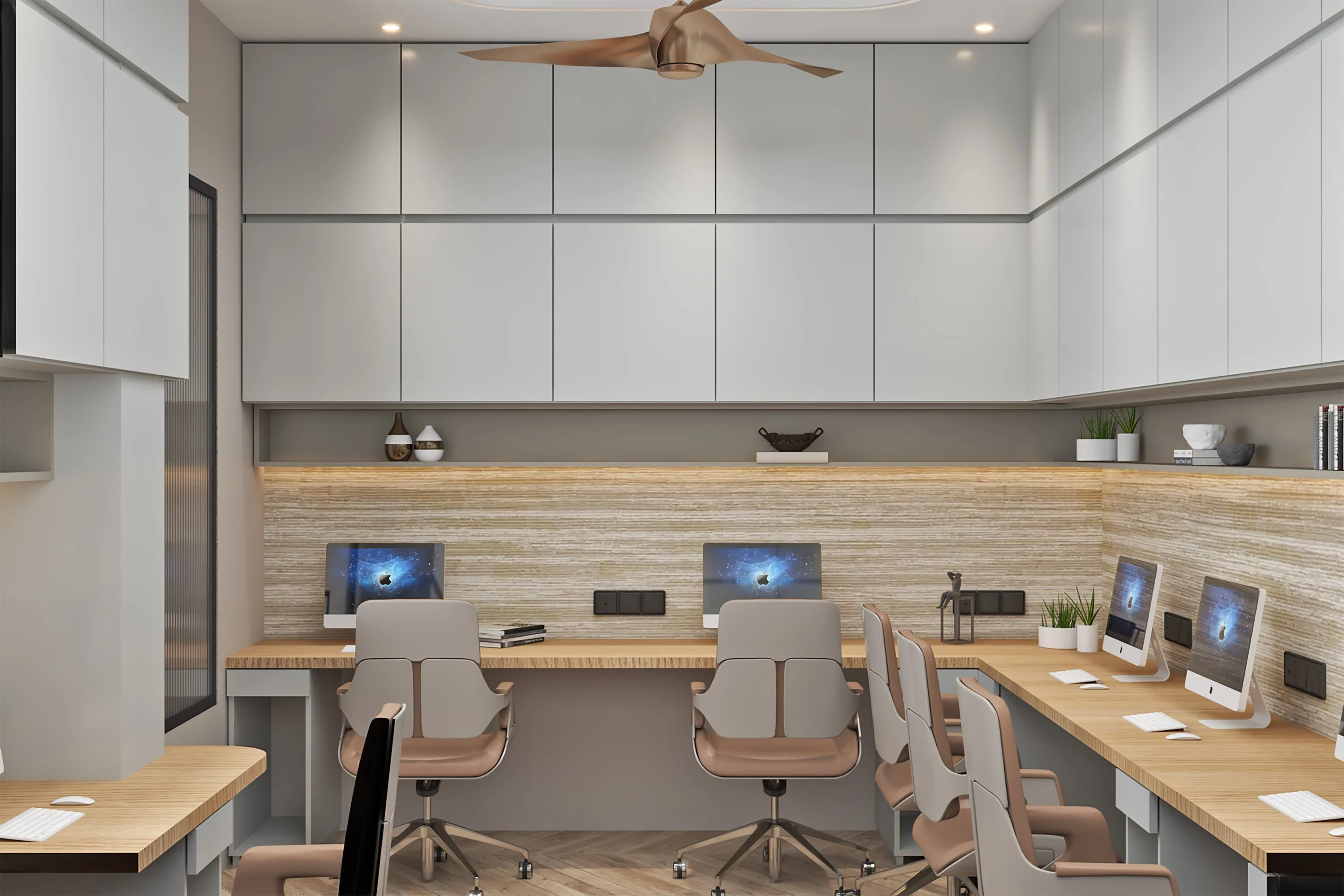 Open workstations with pale oak desking beneath a stone-clad backsplash