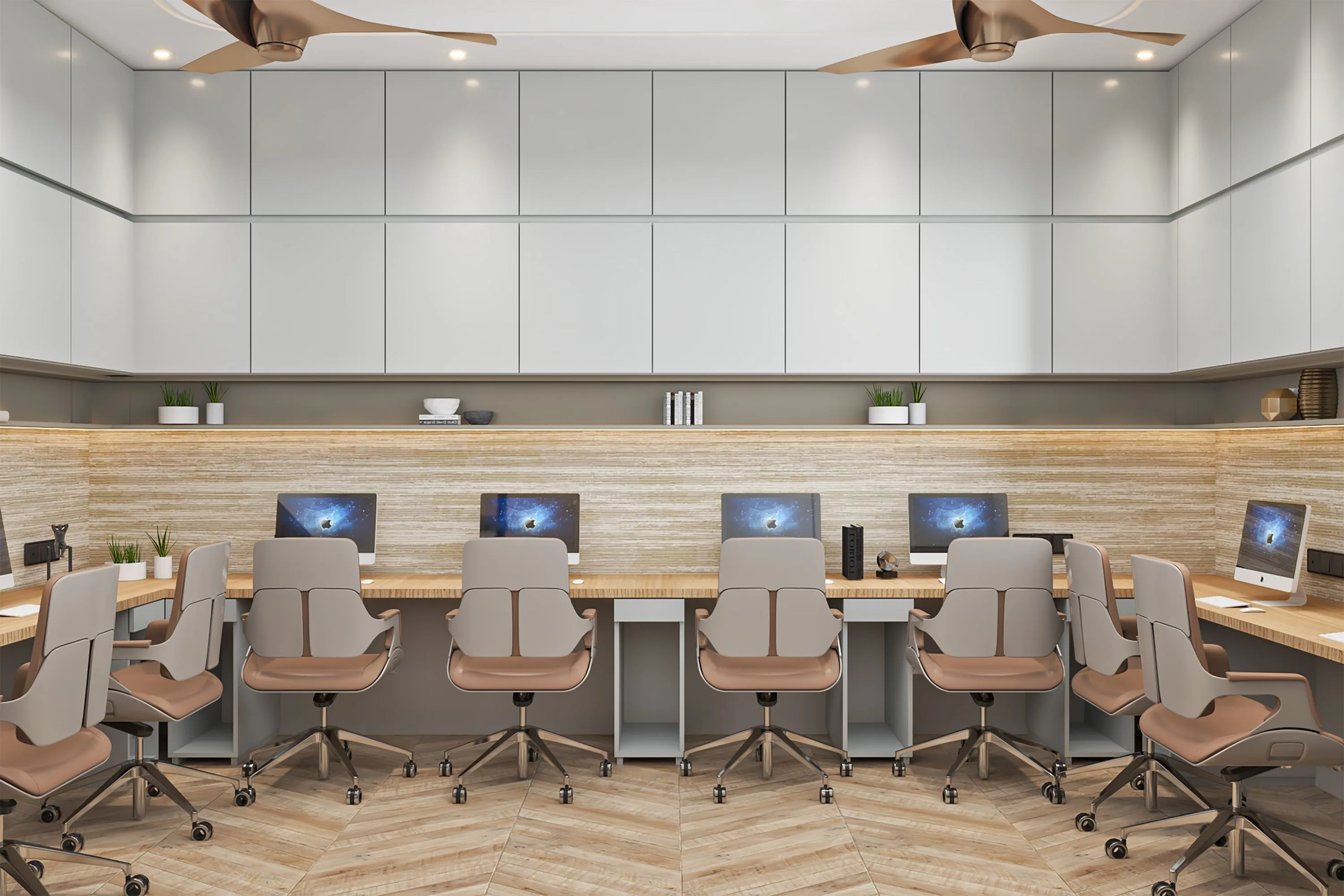 Open workstations in a long run of oak desking beneath white overhead storage