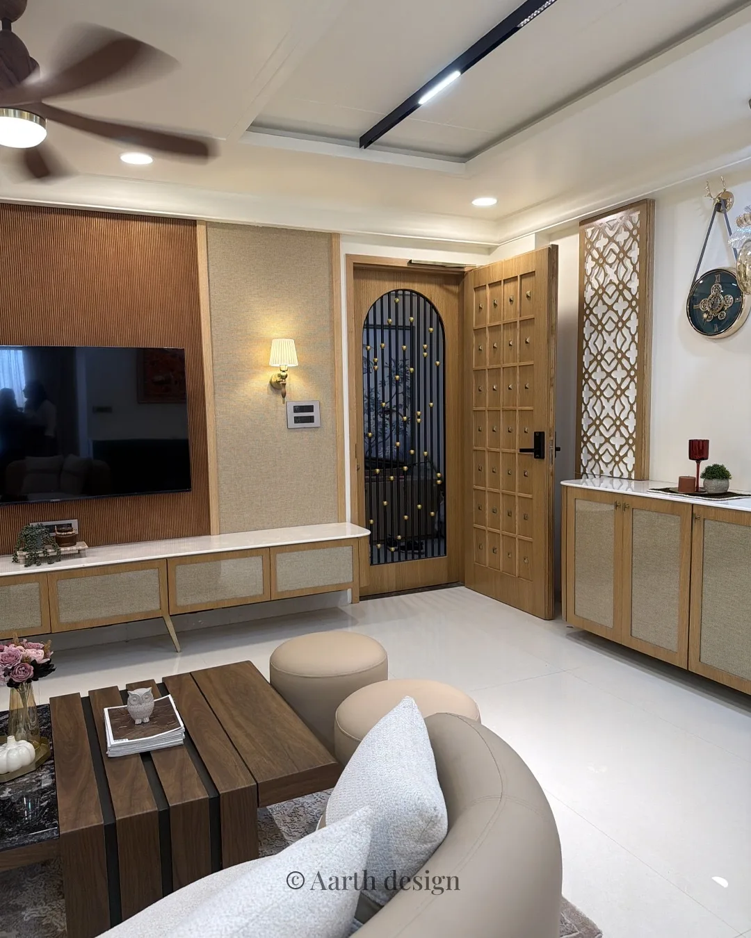 Living room looking toward a carved arched door, with a low marble coffee table