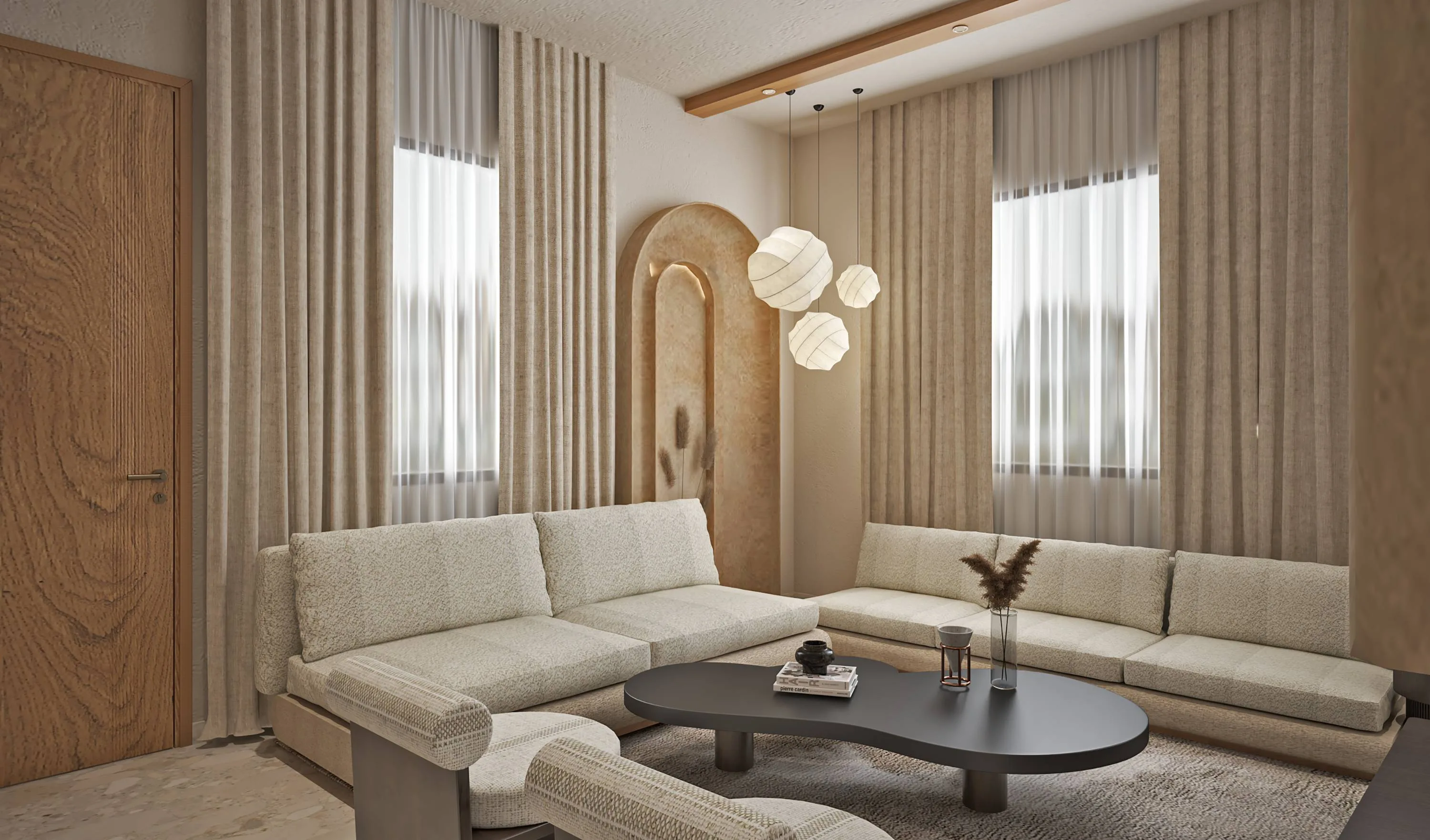 Living room with two arched-niche sofas and a trio of paper pendant lights
